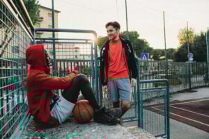 A basketball mentor talking to his client