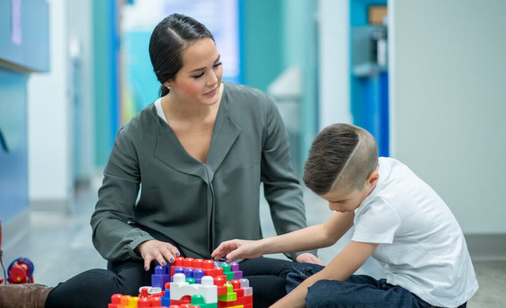 A support assistant helping a young person